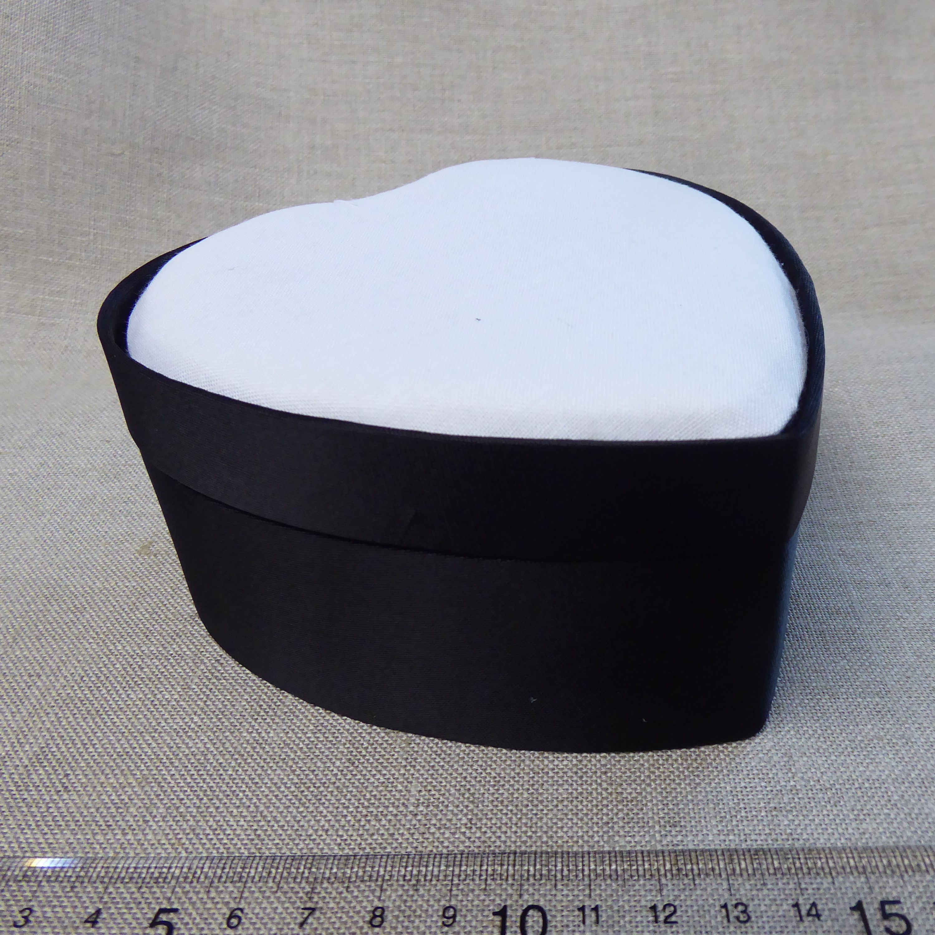 large black satin box with heart shaped aperture